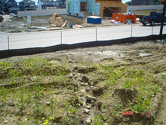 Silt fencing installed along a slope on an AESC site