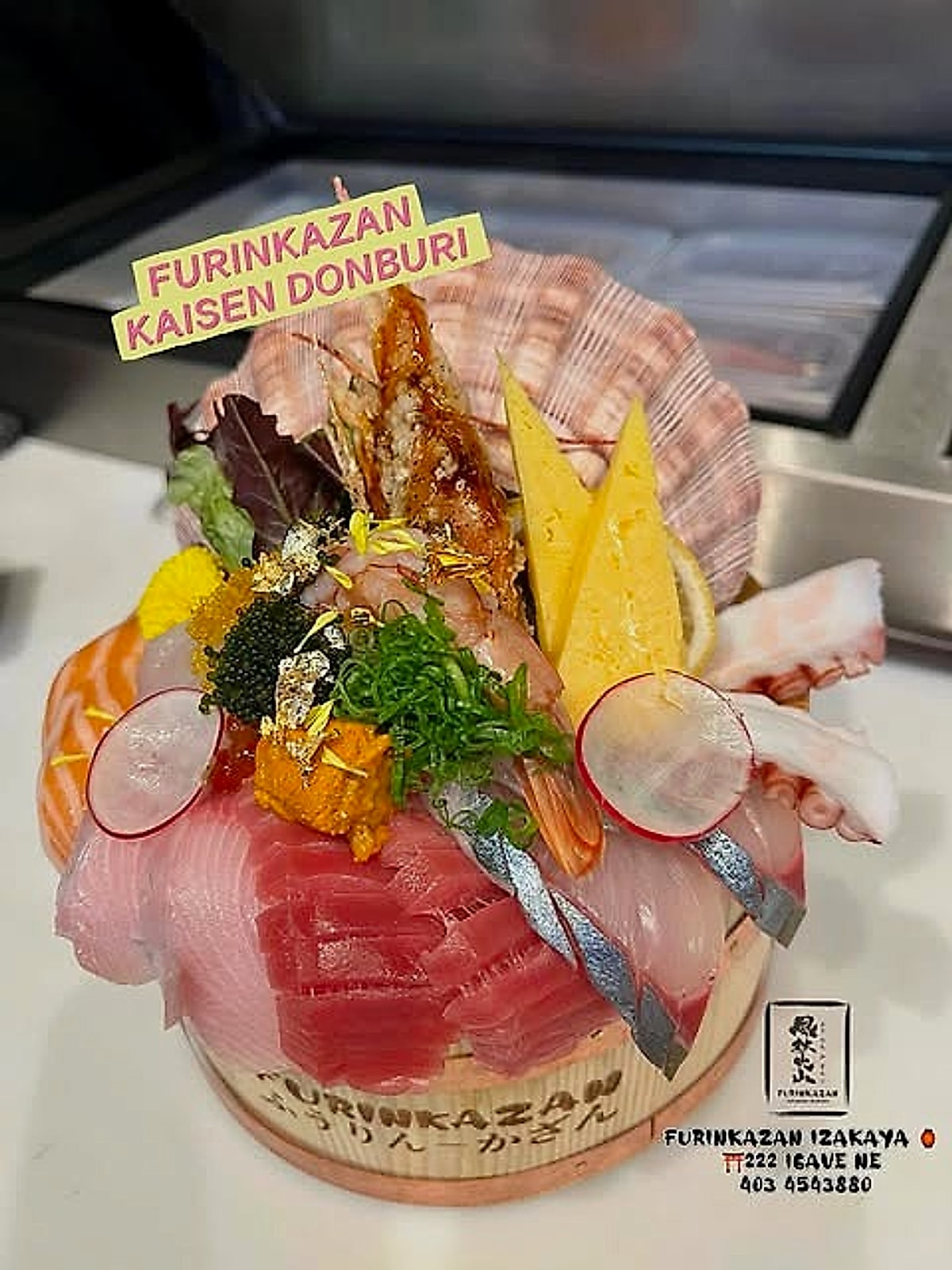 Furinkazan Izakaya kaisen donburi, a seafood rice bowl piled with tuna, salmon, scallop, uni and gold leaf